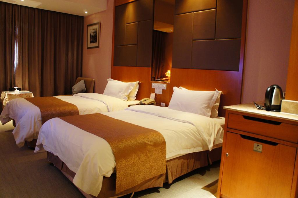 Oriental Hotel Tong Xiang Цзясин Номер фото